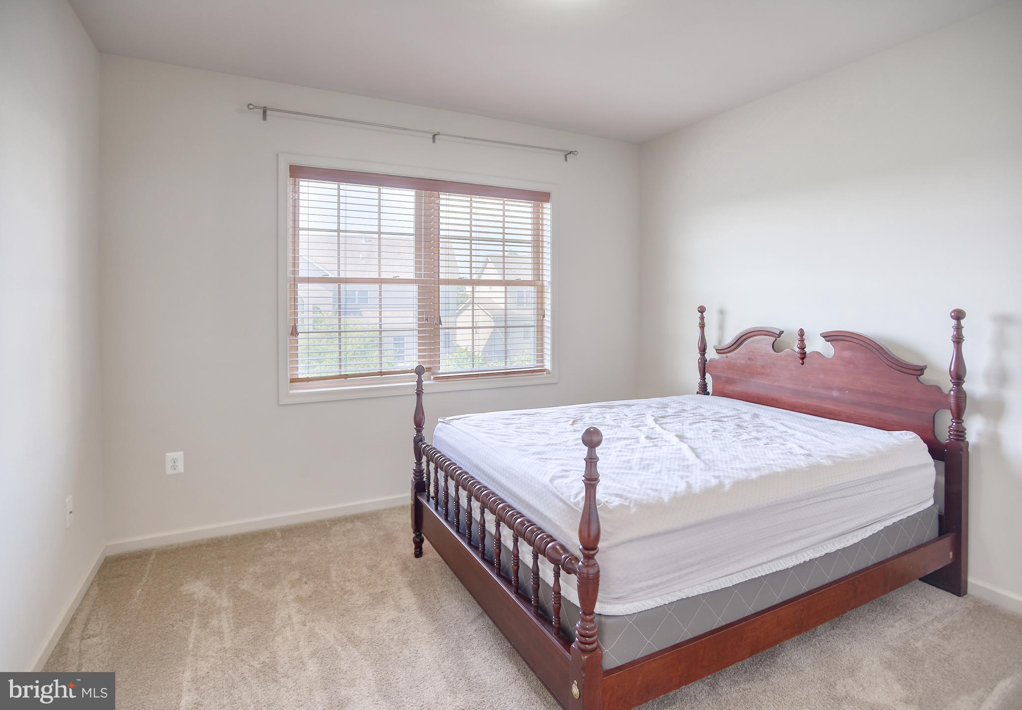 13336 Redspire Drive Silver Spring, MD 20906 - Photo 32 of 66 a bedroom with a bed and window
