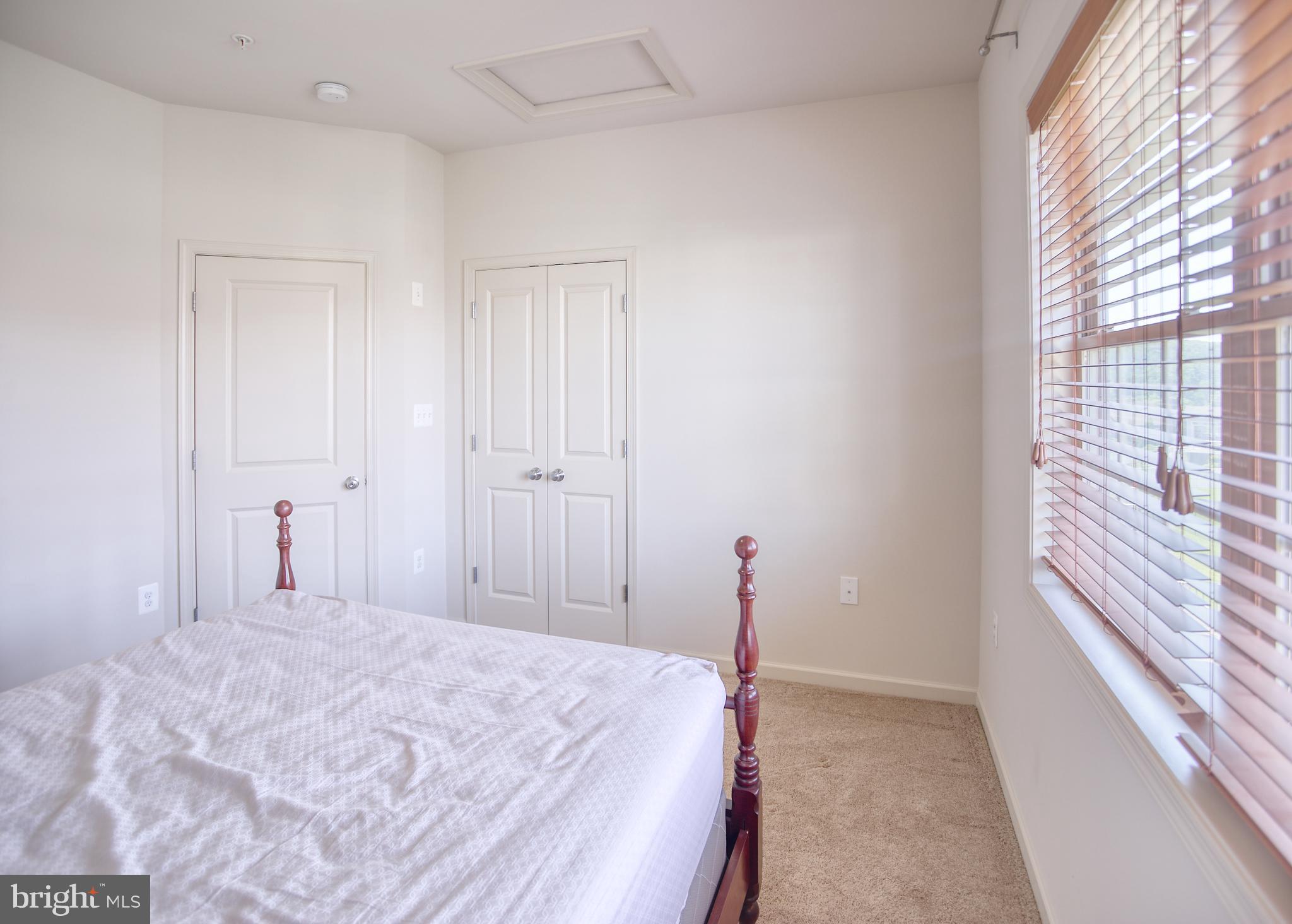 13336 Redspire Drive Silver Spring, MD 20906 - Photo 33 of 66 a bedroom with a bed and a window