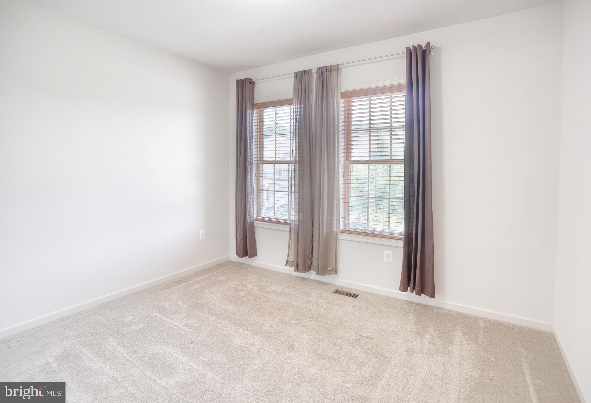 13336 Redspire Drive Silver Spring, MD 20906 - Photo 36 of 66 a view of an empty room with a window