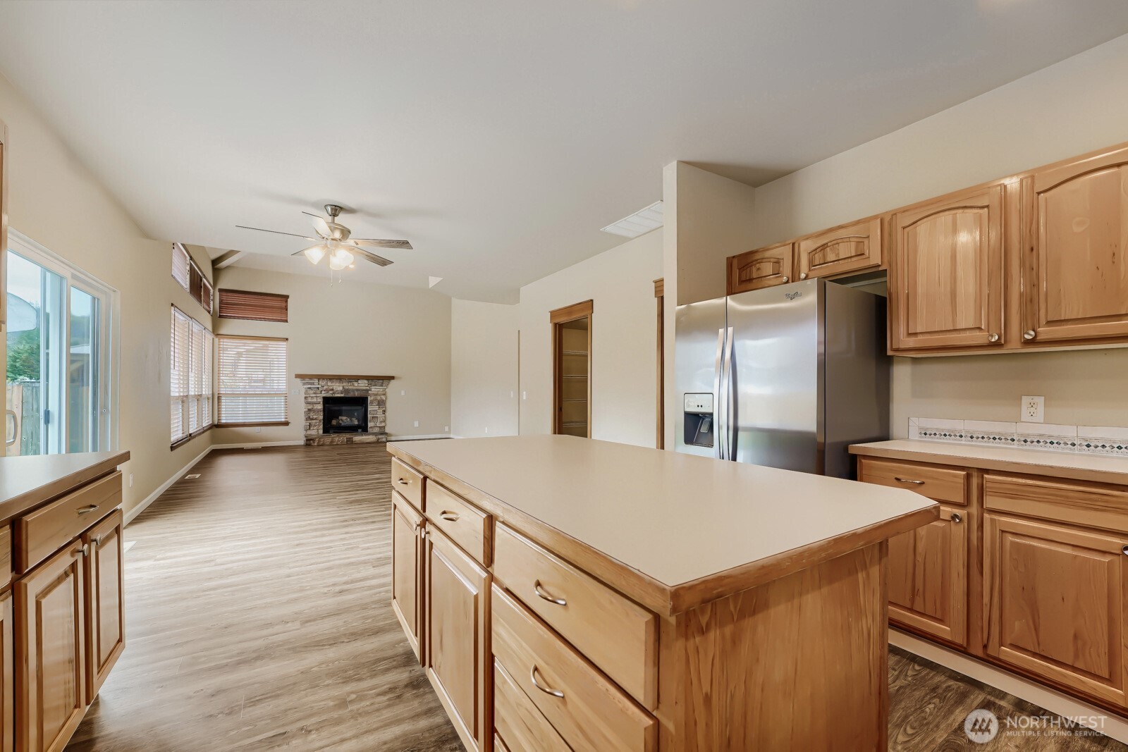 1104 Williams Street Northwest Orting, WA 98360 - Photo 11 of 27 a kitchen with kitchen island a sink stove and refrigerator