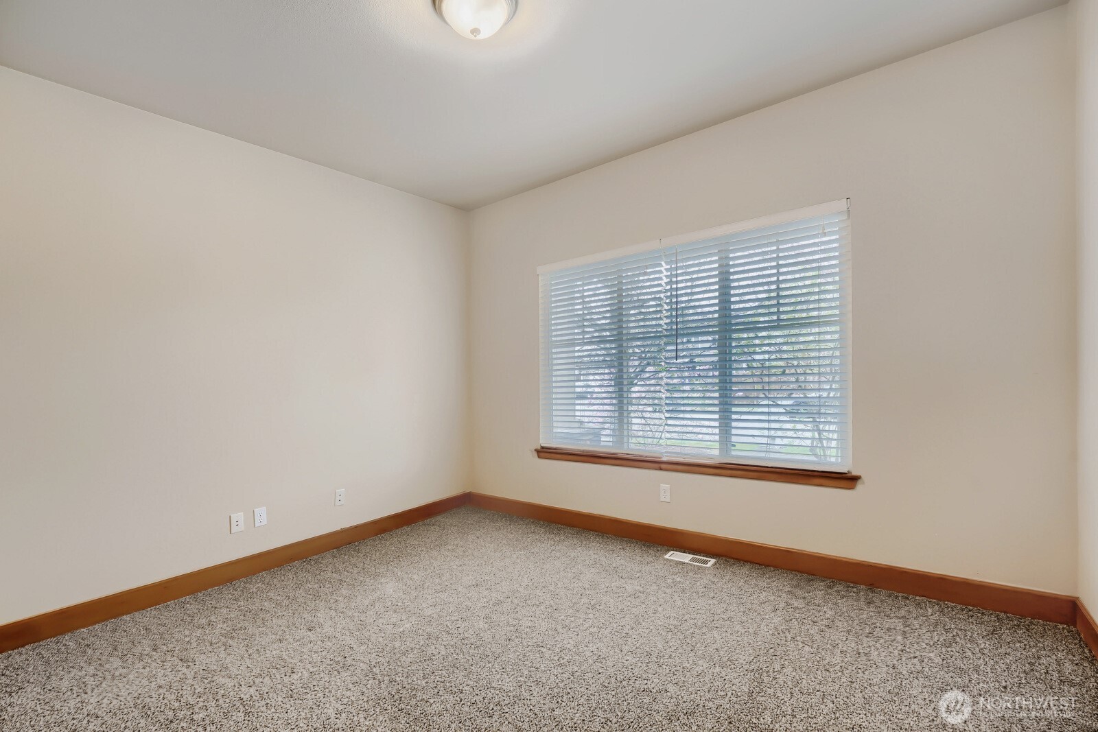 1104 Williams Street Northwest Orting, WA 98360 - Photo 17 of 27 an empty room with a window