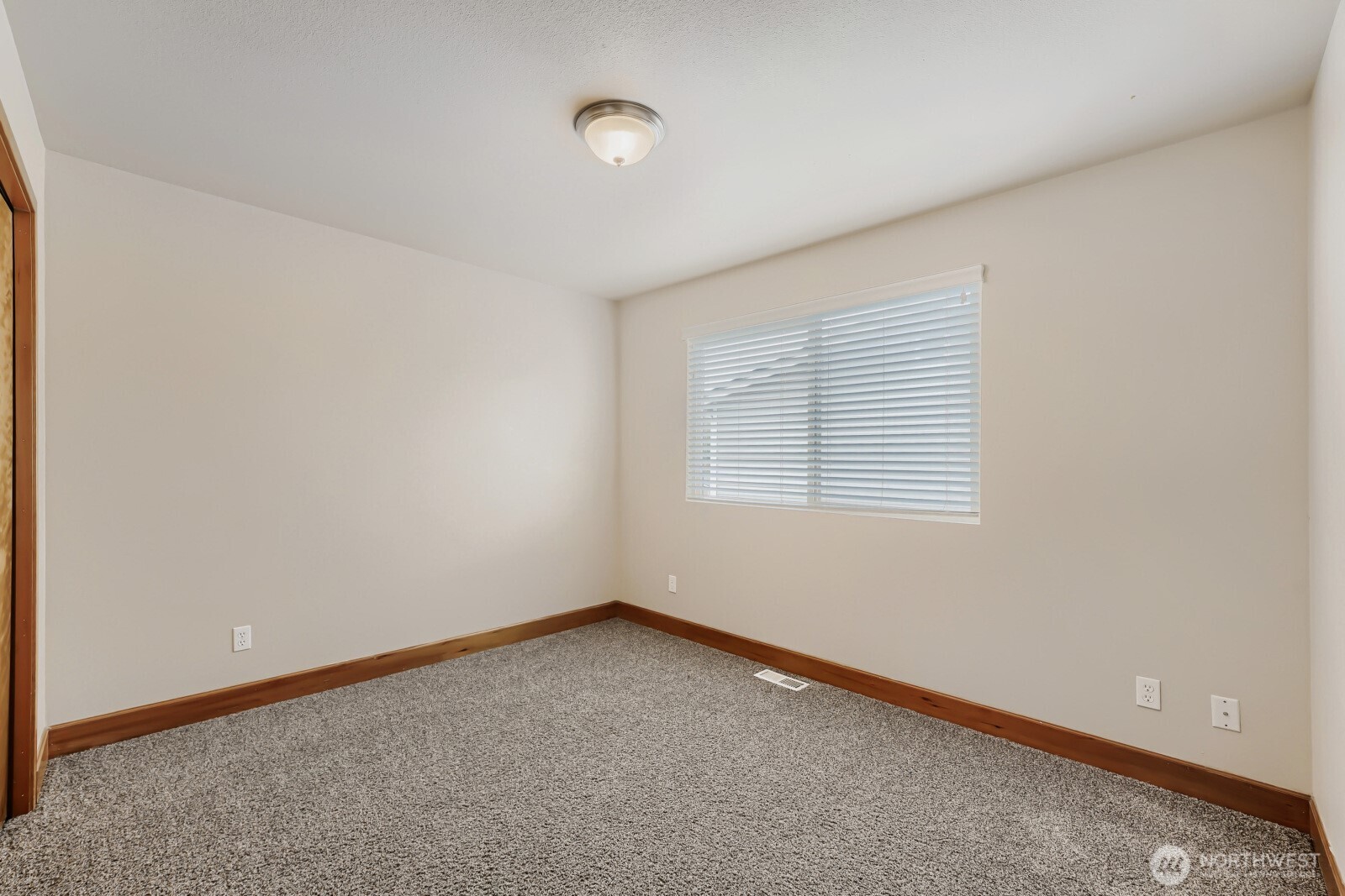 1104 Williams Street Northwest Orting, WA 98360 - Photo 20 of 27 an empty room with a window