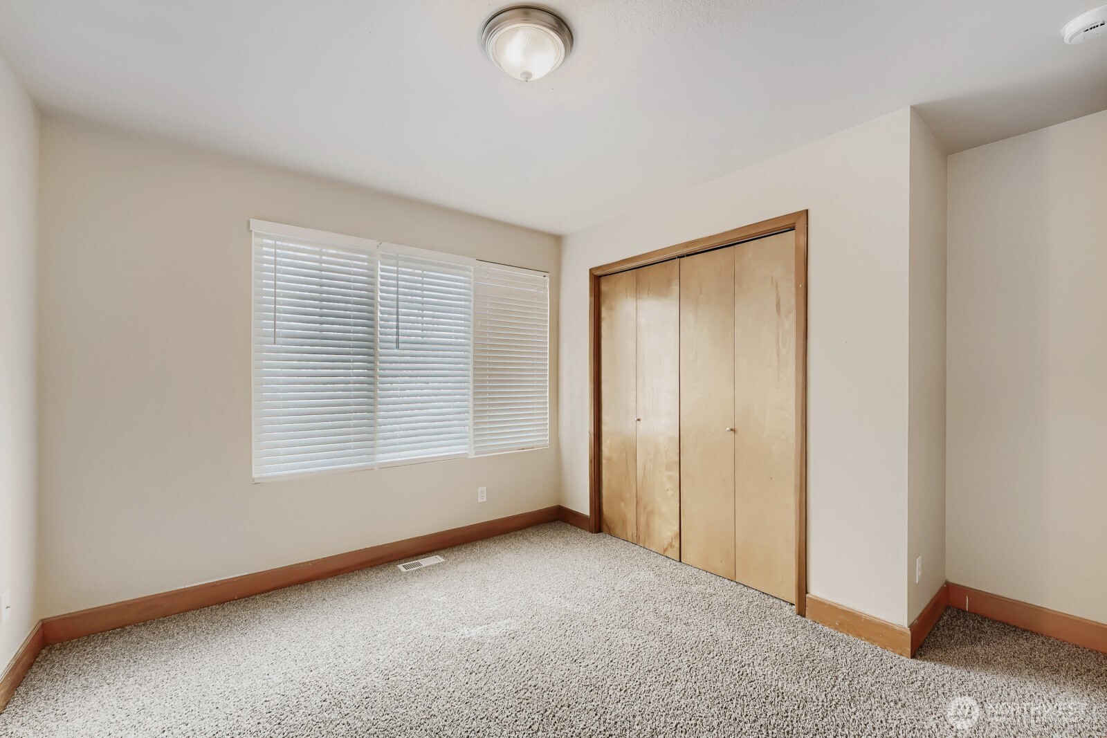 1104 Williams Street Northwest Orting, WA 98360 - Photo 21 of 27 a view of an empty room with a window