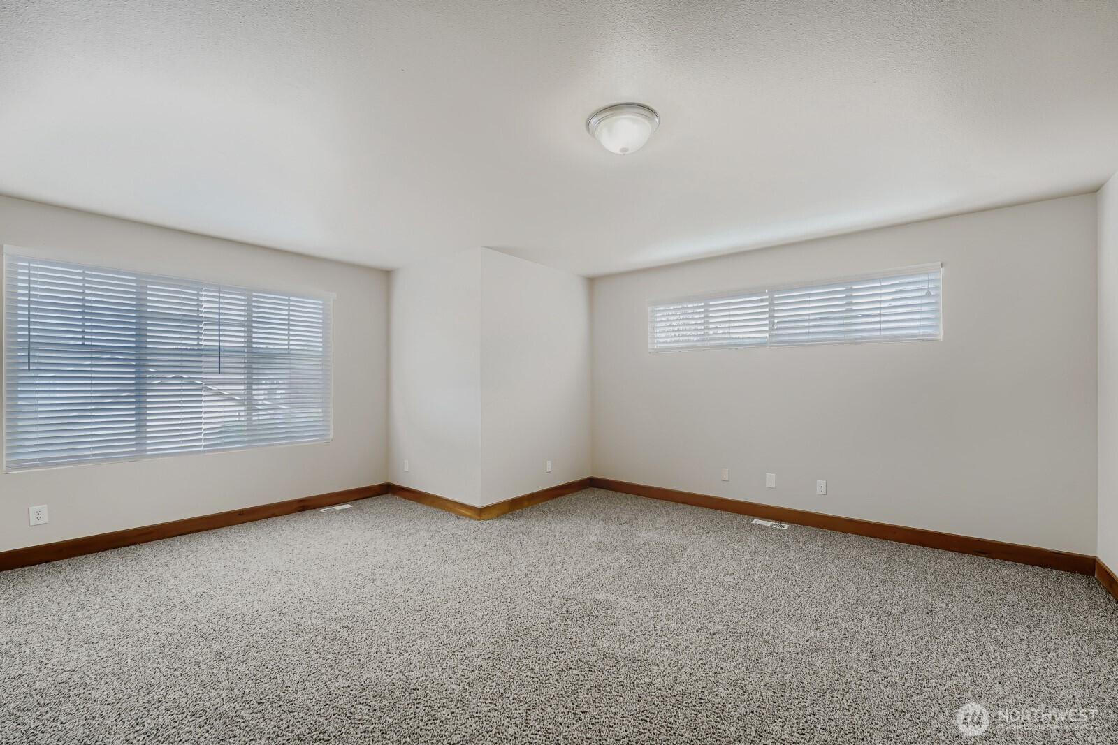 1104 Williams Street Northwest Orting, WA 98360 - Photo 22 of 27 an empty room with windows