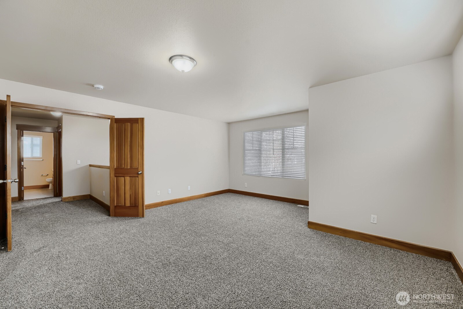 1104 Williams Street Northwest Orting, WA 98360 - Photo 23 of 27 a view of an empty room with closet and a window