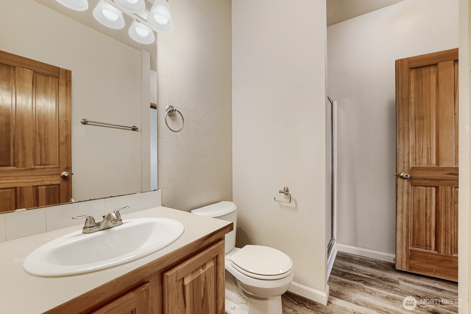 1104 Williams Street Northwest Orting, WA 98360 - Photo 24 of 27 a bathroom with a sink a toilet and shower