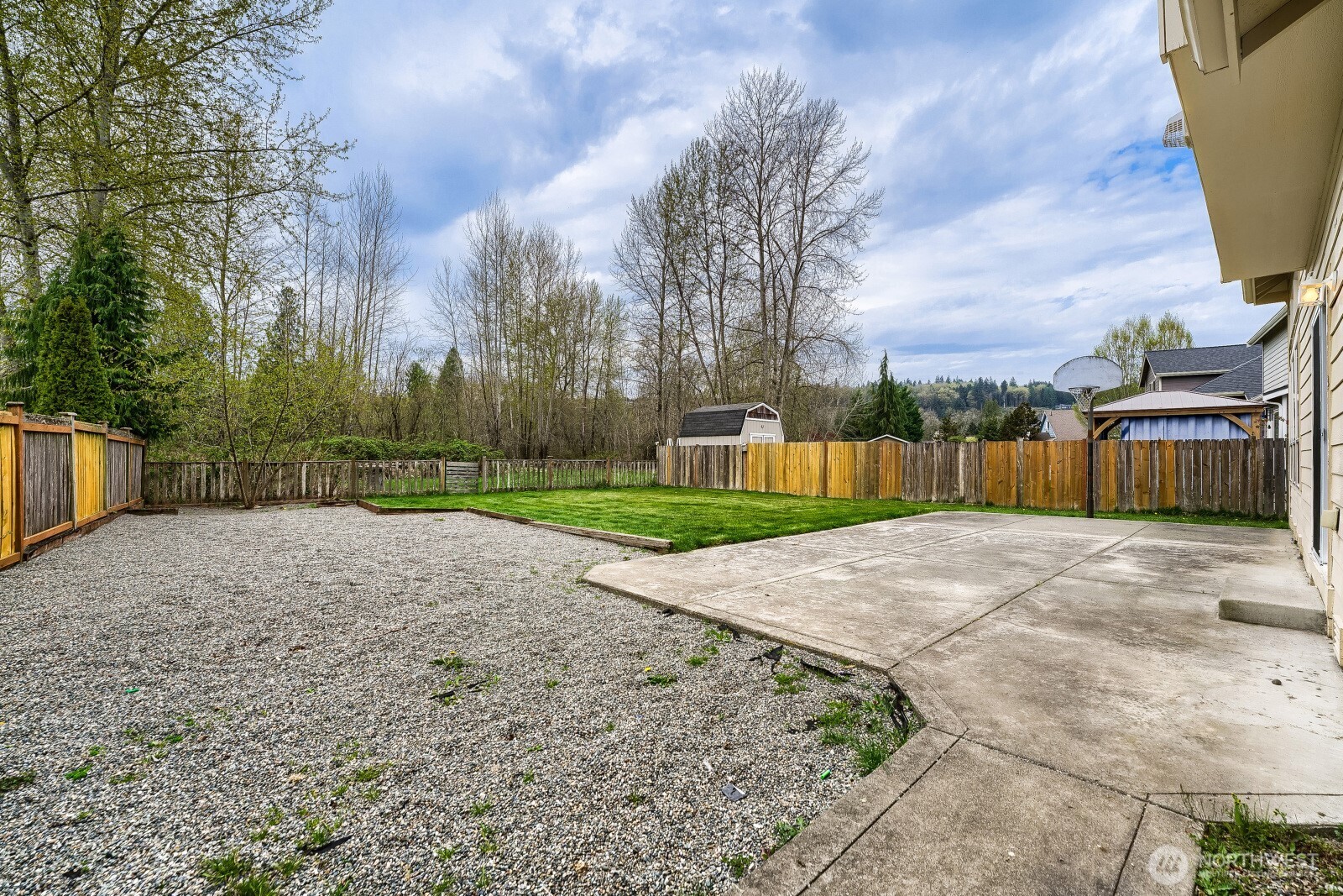 1104 Williams Street Northwest Orting, WA 98360 - Photo 25 of 27 a view of a backyard with green space