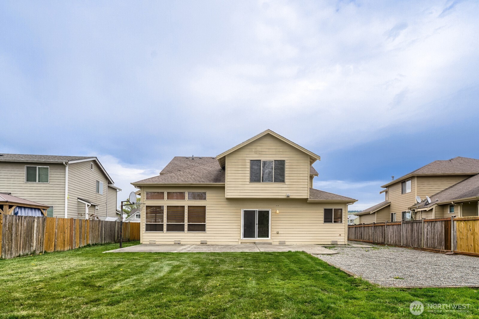 1104 Williams Street Northwest Orting, WA 98360 - Photo 26 of 27 a front view of a house with a yard and garage