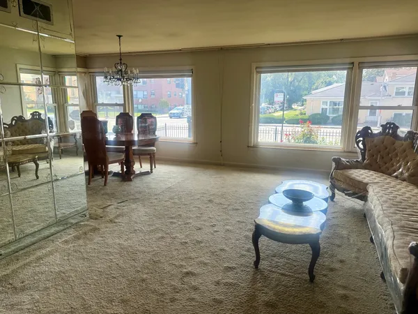 a dining room with furniture and window