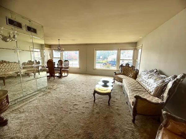a living room with furniture and a table