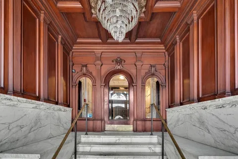 a view of a fireplace with a chandelier