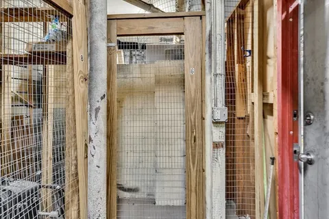a bathroom with a glass shower door