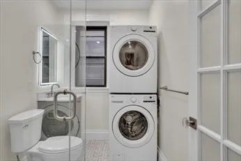 a bathroom with a toilet and a sink