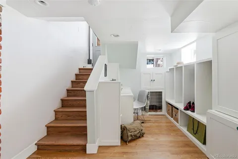 a view of a backyard with table and chairs with wooden fence