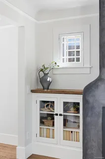 a kitchen with stainless steel appliances a stove a sink dishwasher a refrigerator and a stove with wooden floor