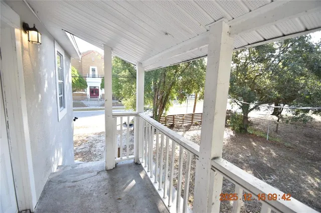 a view of a porch and garden
