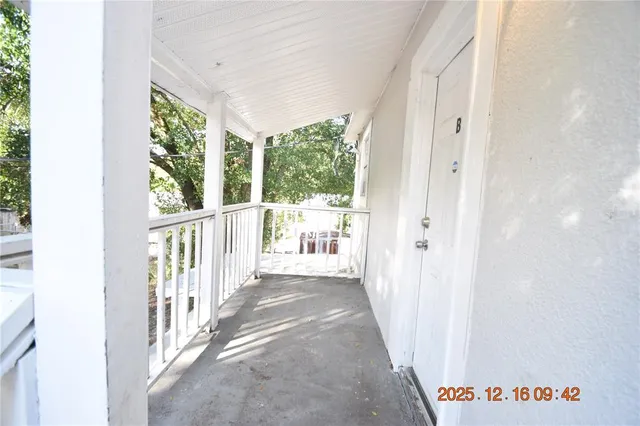 a view of a hallway with windows