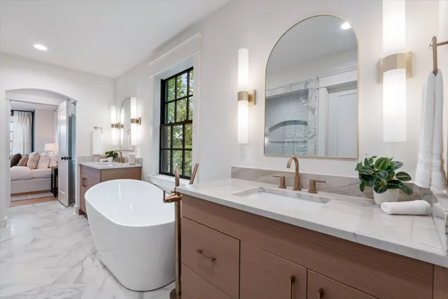 a bath room with a sink and a mirror