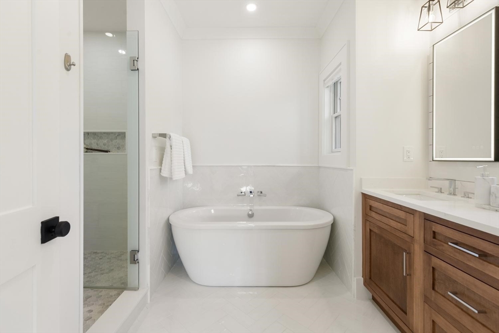 1124 Chestnut Street Newton, MA 02464 - Photo 19 of 41 a bathroom with a bathtub and shower