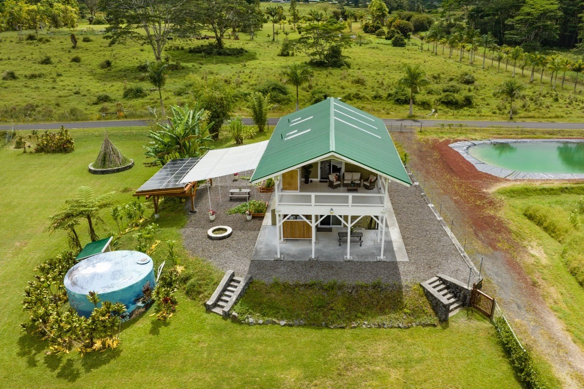 a aerial view of a house with a yard