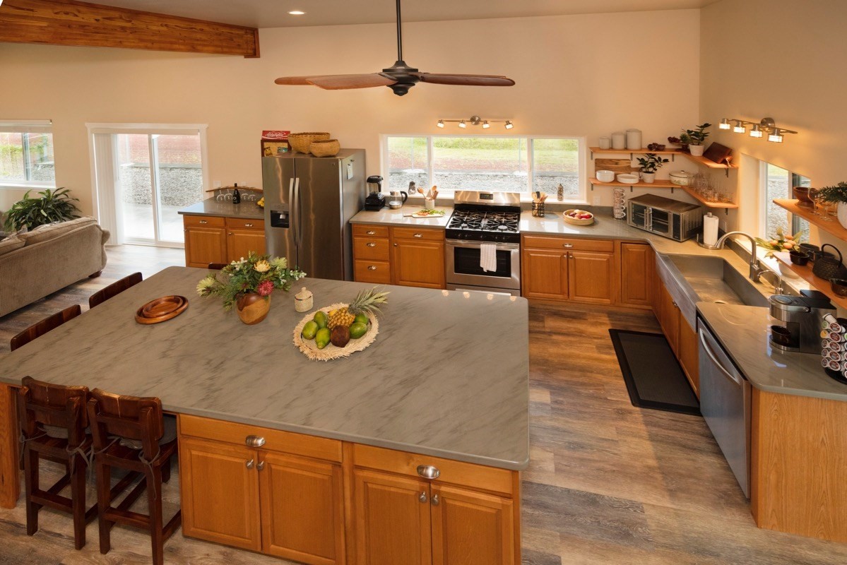 17-3926 Enos Road Mountain View, HI 96771 - Photo 12 of 30 a kitchen with stainless steel appliances granite countertop a sink a stove and a refrigerator