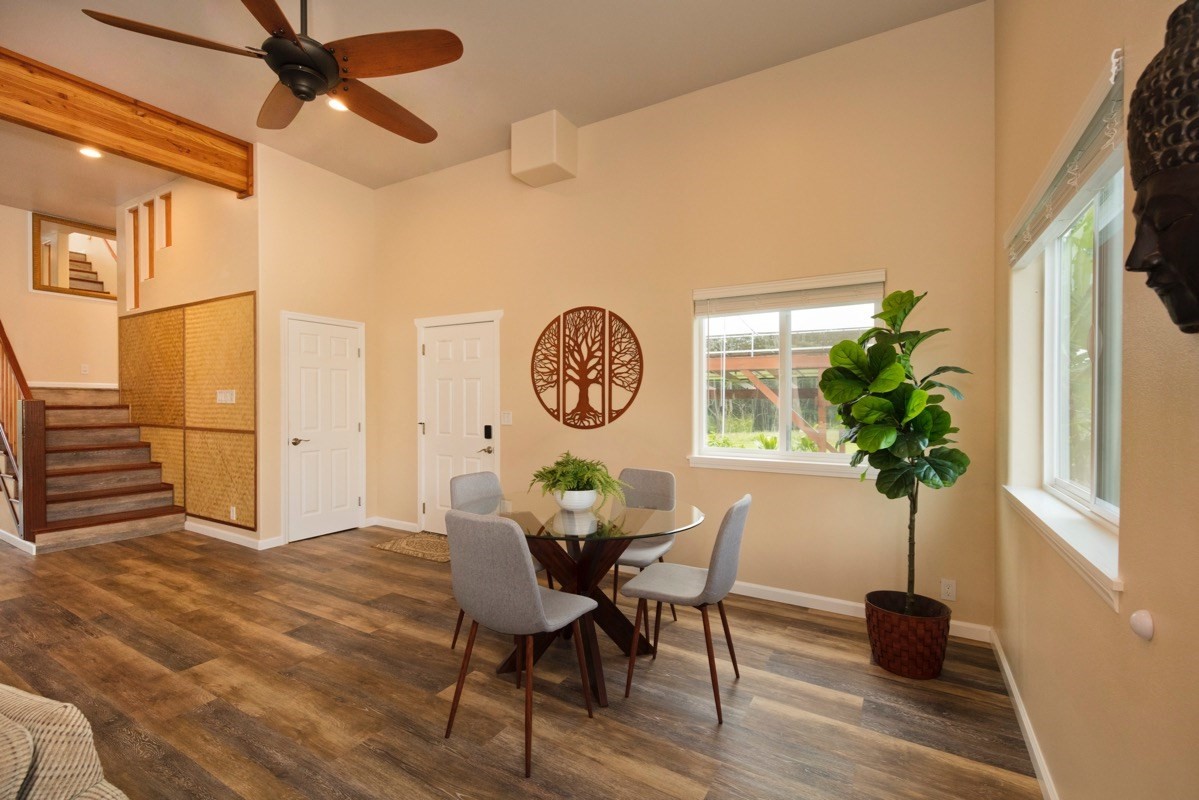 17-3926 Enos Road Mountain View, HI 96771 - Photo 13 of 30 a view of a dining room with furniture and a potted plant
