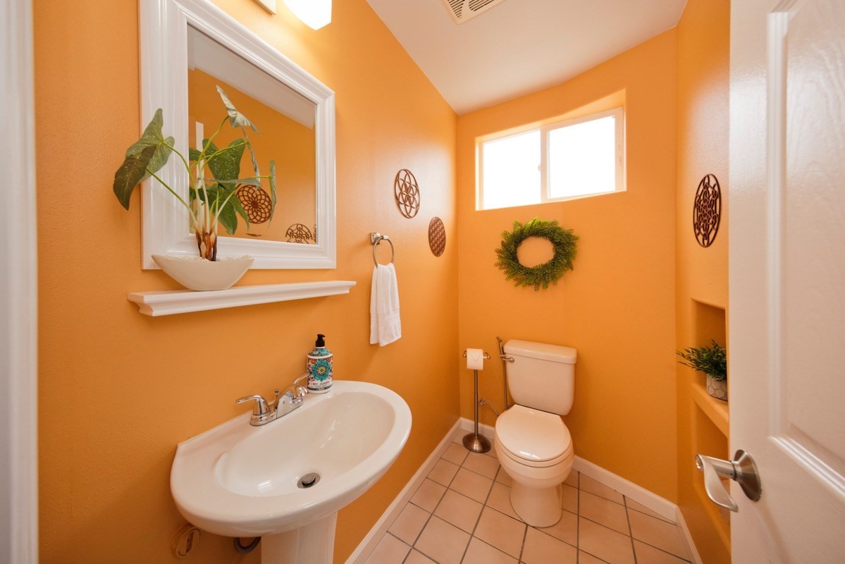 17-3926 Enos Road Mountain View, HI 96771 - Photo 14 of 30 a bathroom with a toilet sink and mirror