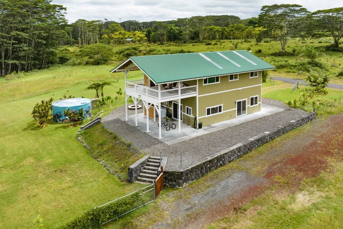 17-3926 Enos Road Mountain View, HI 96771 - Photo 2 of 30 an aerial view of a house with a big yard