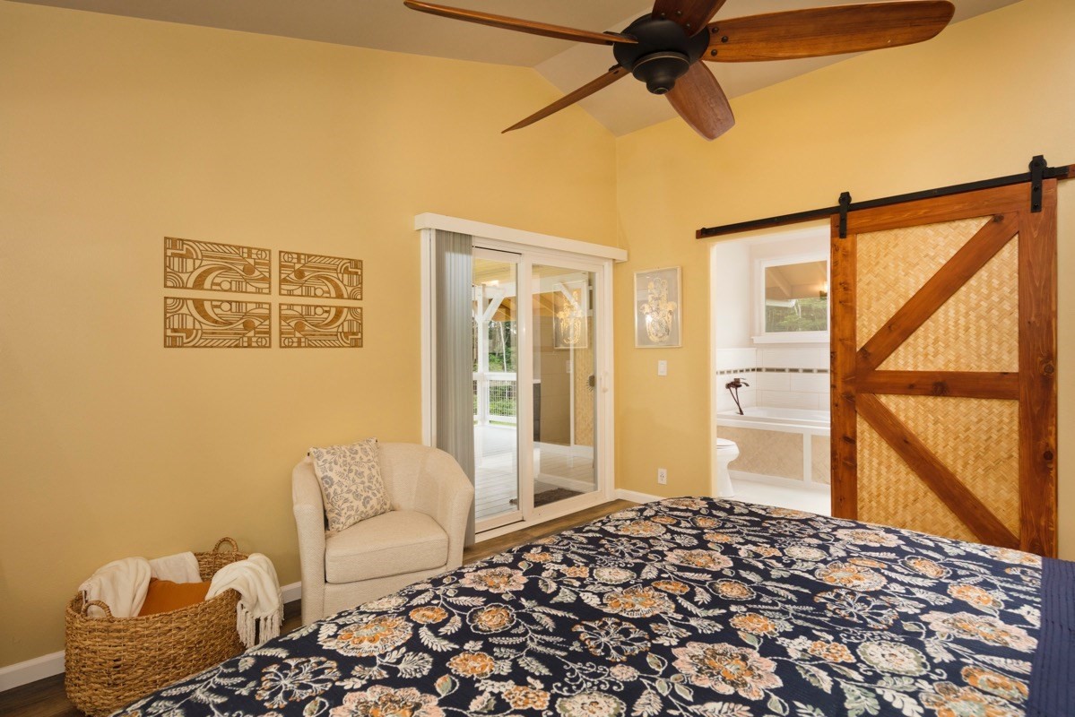 17-3926 Enos Road Mountain View, HI 96771 - Photo 26 of 30 a bedroom with a bed and glass window