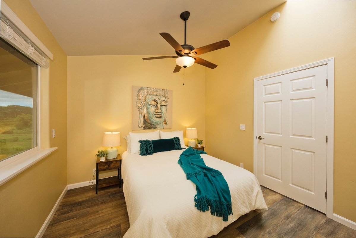 17-3926 Enos Road Mountain View, HI 96771 - Photo 29 of 30 a bedroom with a bed and a table