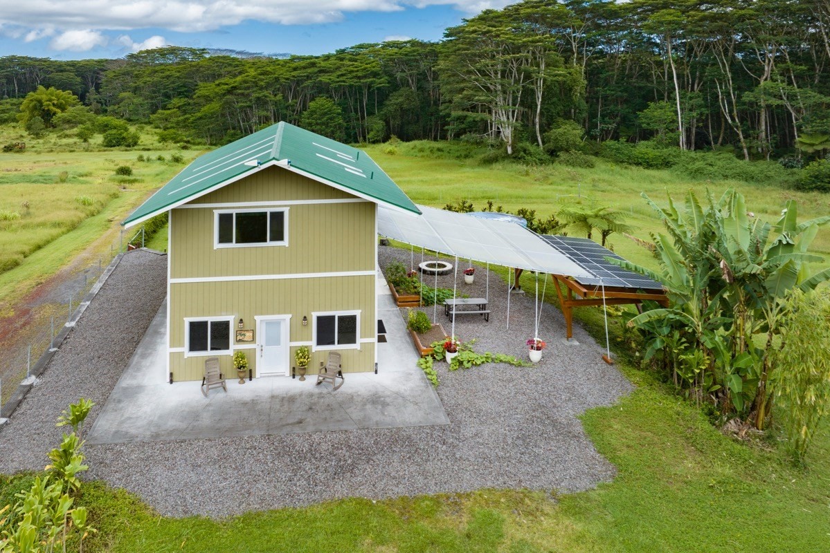 17-3926 Enos Road Mountain View, HI 96771 - Photo 3 of 30 a front view of a house with garden