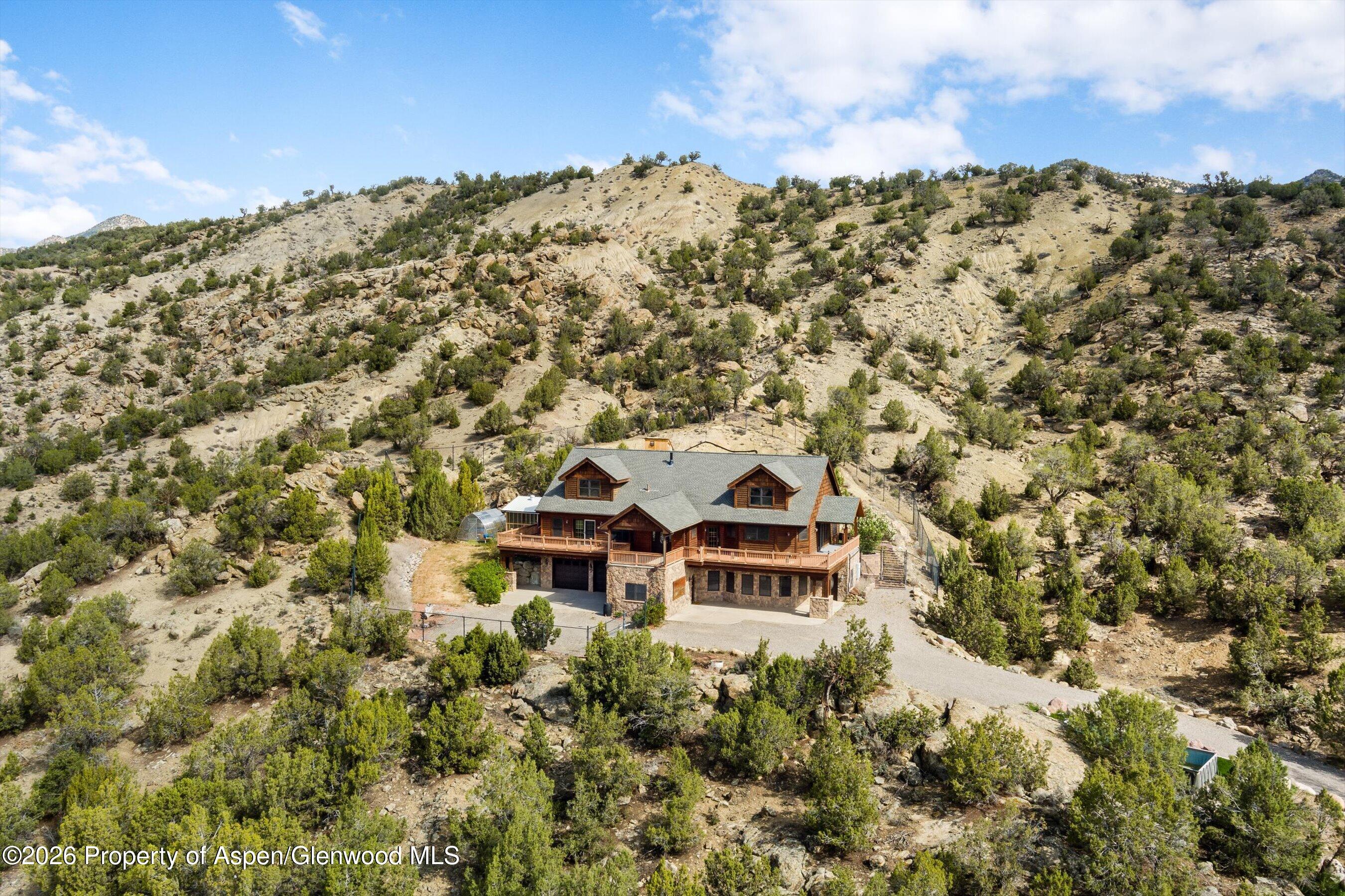 450 Summer Falls Road Silt, CO 81652 - Photo 44 of 50 a view of a large building with a mountain in the background