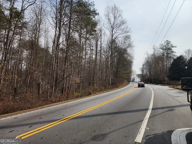 a view of balcony with yard