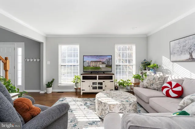 a kitchen with stainless steel appliances granite countertop a stove a refrigerator and a microwave oven