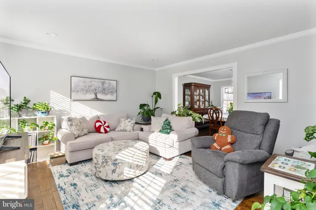 a kitchen with stainless steel appliances granite countertop white cabinets sink and window