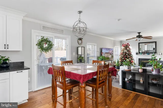 a bedroom with a bed couch and a window