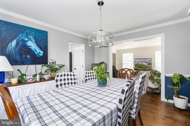 a bathroom with a tub a double vanity sink and mirror