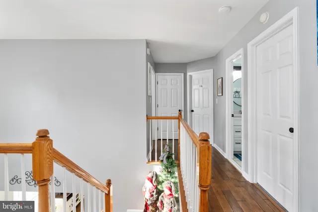 a bedroom with furniture and a flat screen tv