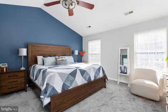 a bedroom with a bed and a couch