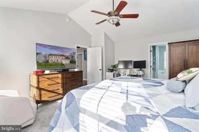 a bathroom with a sink mirror and toilet