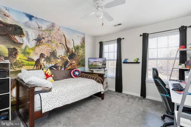 a view of yard with swimming pool and wooden fence