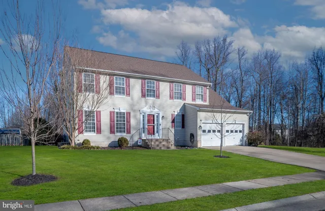 a view of entryway with livingroom and wooden floor