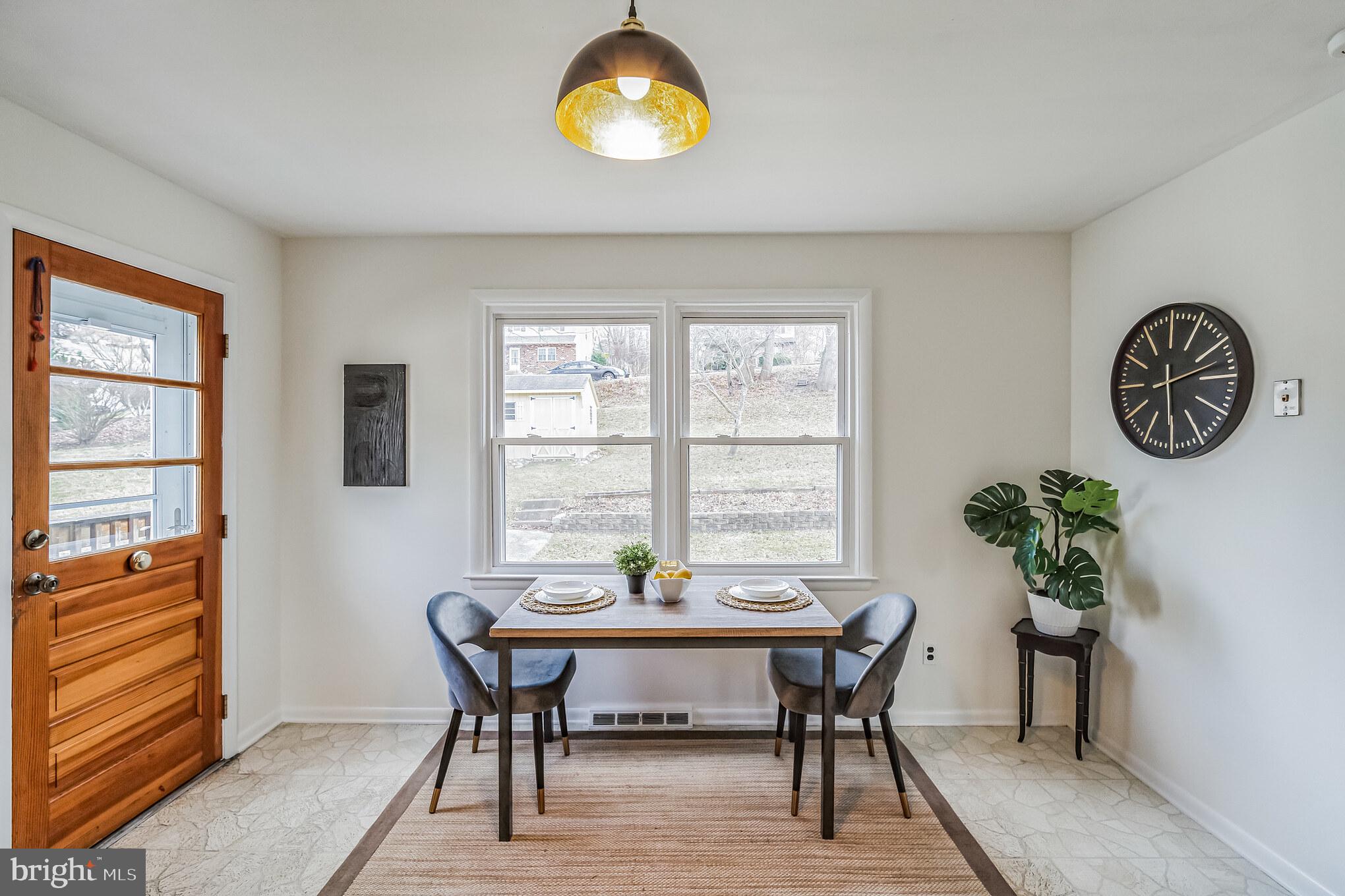645 Glendale Road Havertown, PA 19083 - Photo 11 of 36 a view of a dining room with furniture window and wooden floor