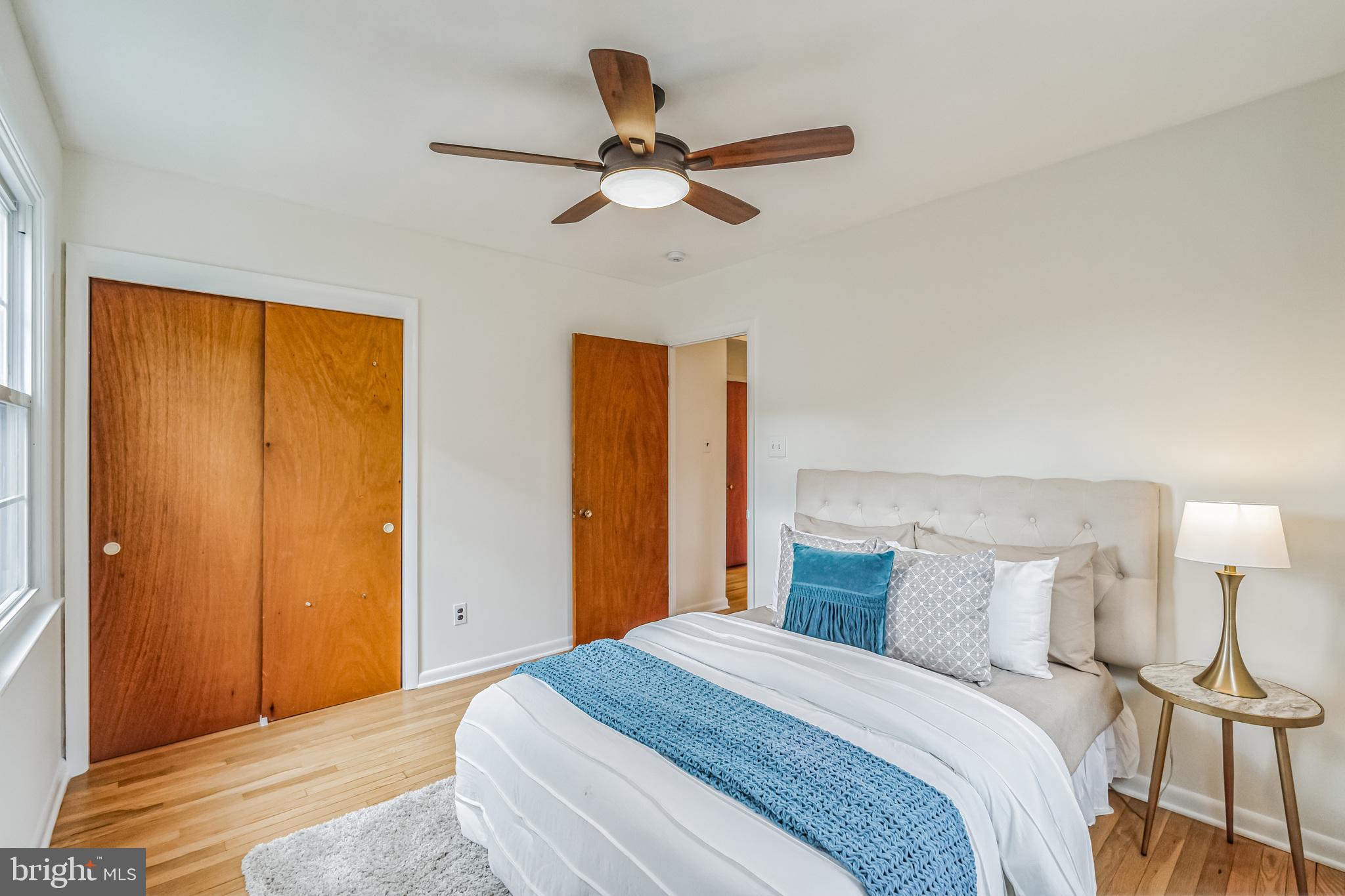 645 Glendale Road Havertown, PA 19083 - Photo 17 of 36 a bedroom with a bed and a ceiling fan