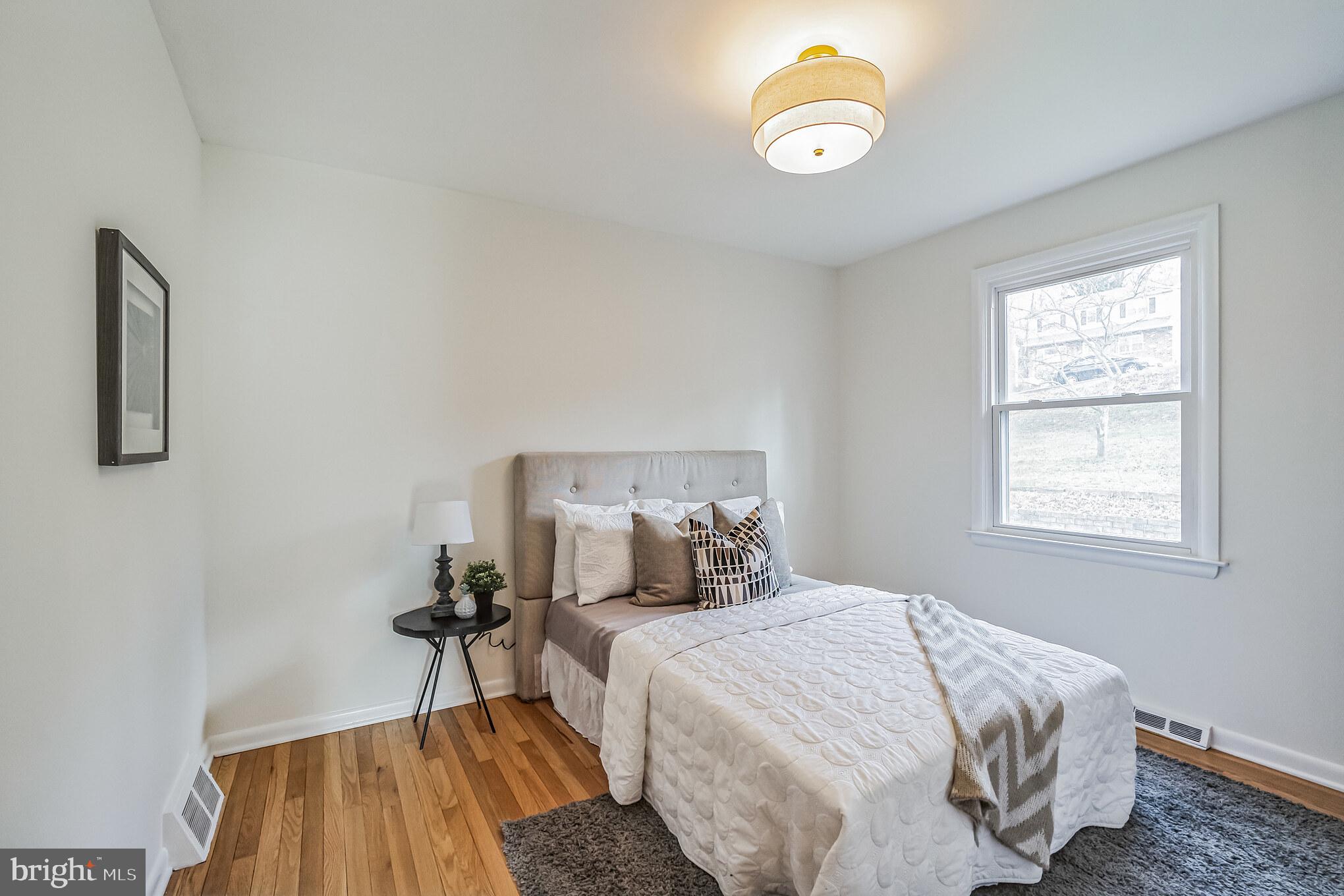 645 Glendale Road Havertown, PA 19083 - Photo 19 of 36 a bedroom with a bed and a window