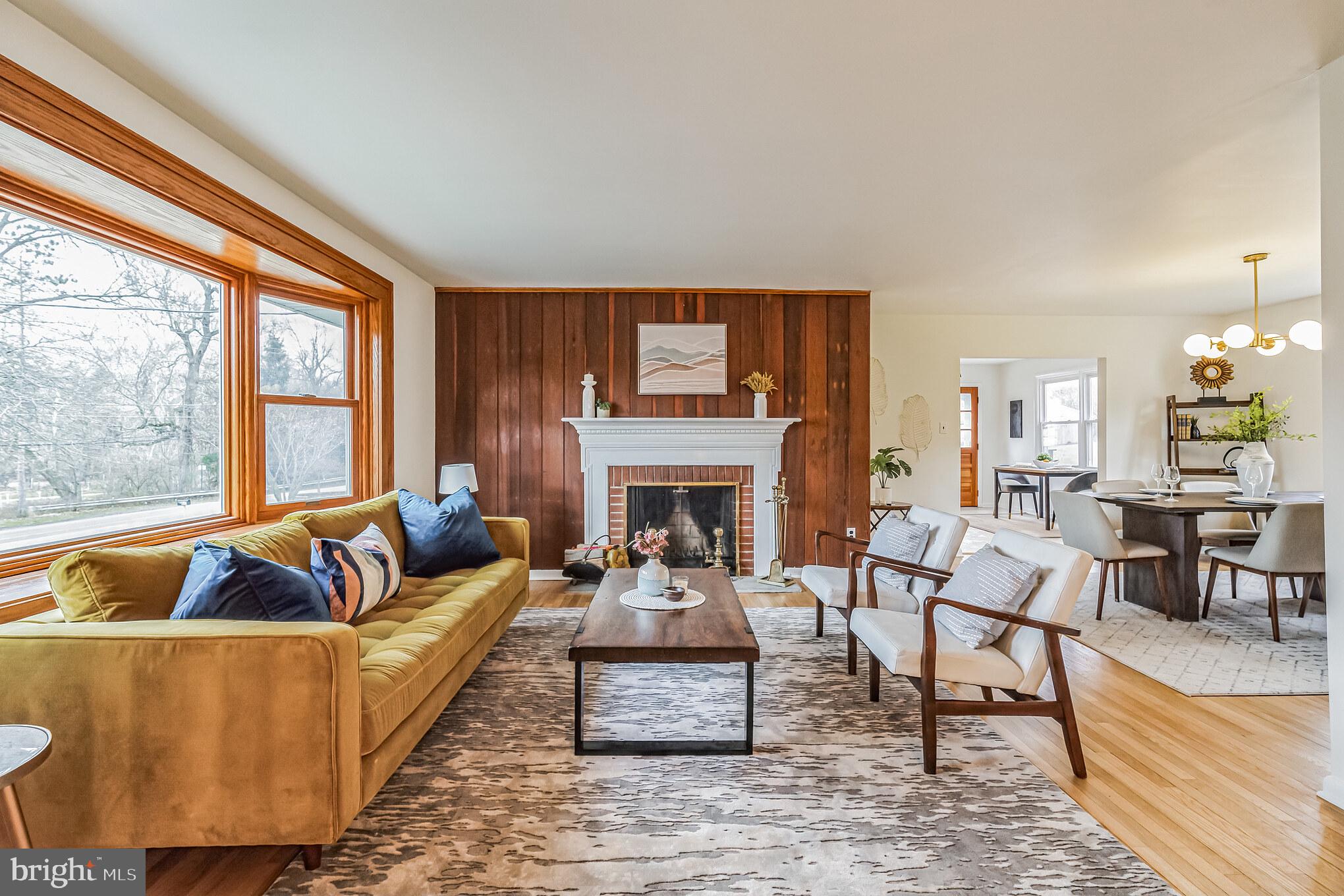 645 Glendale Road Havertown, PA 19083 - Photo 2 of 36 a living room with furniture fireplace and a large window