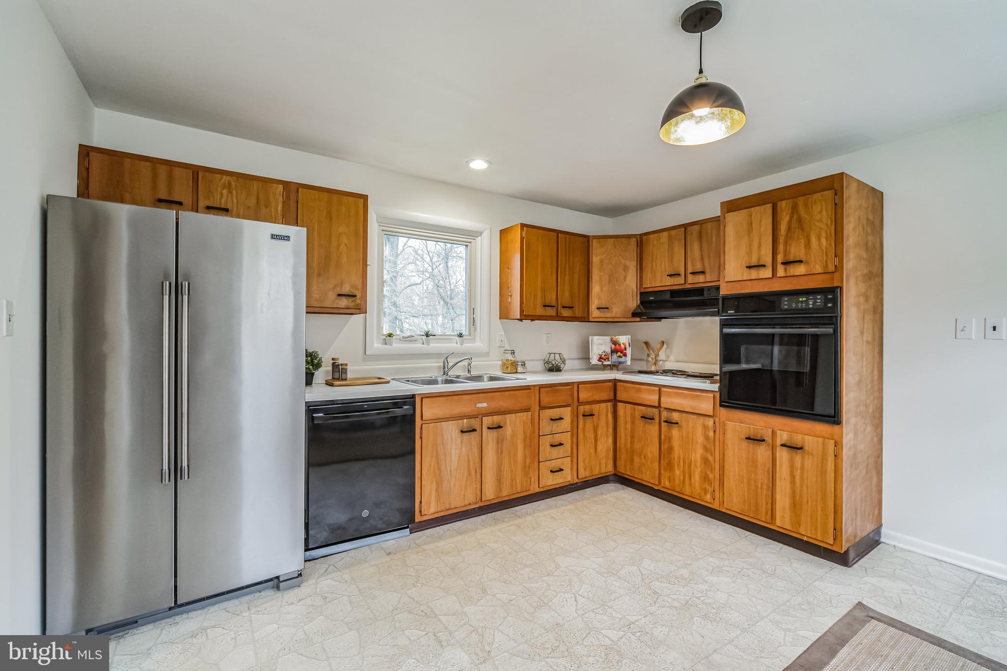 645 Glendale Road Havertown, PA 19083 - Photo 10 of 36 a kitchen with stainless steel appliances granite countertop a refrigerator a stove top oven a sink and dishwasher