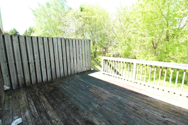 a balcony with wooden floor
