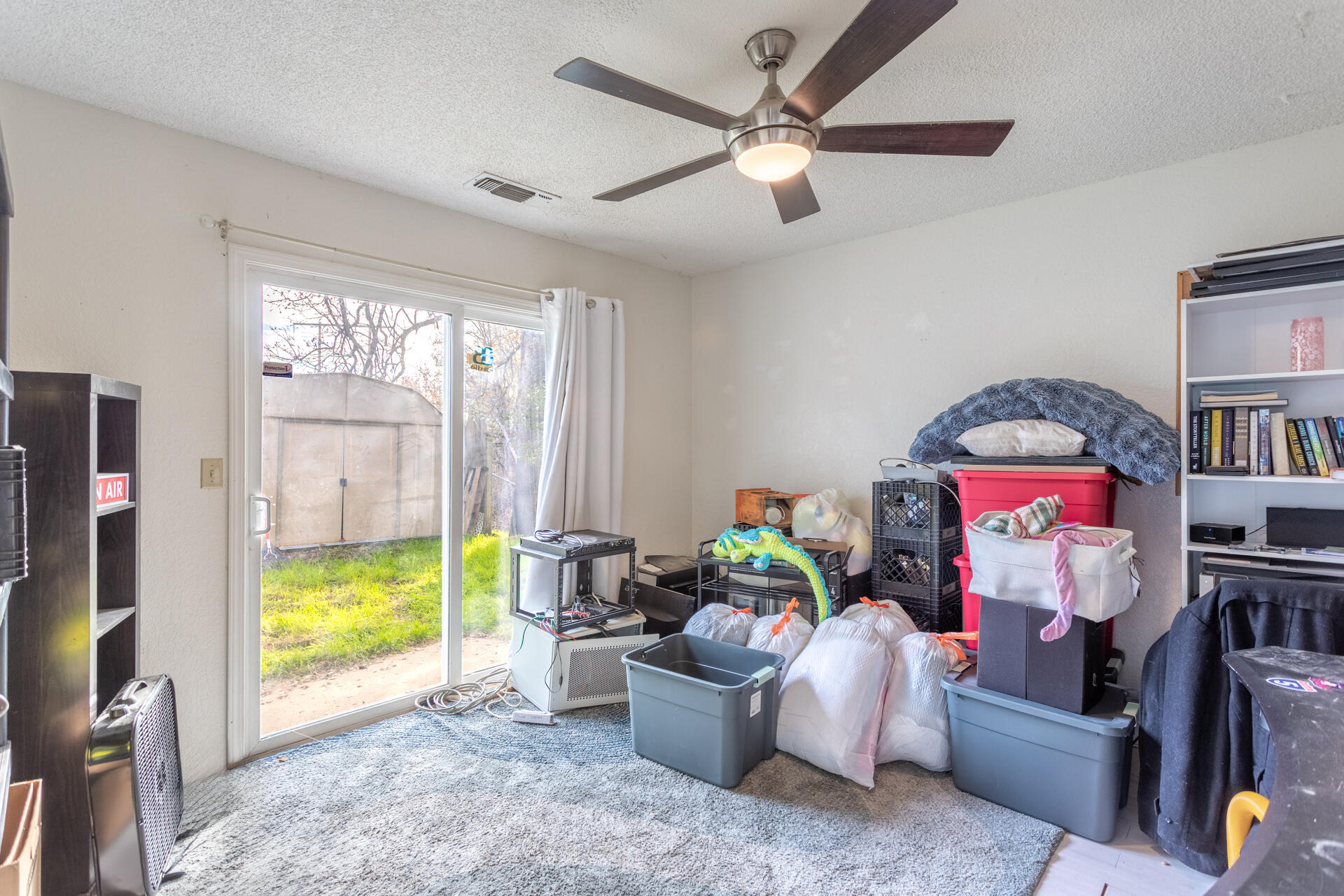 4720 Enchanted Way Redding, CA 96001 - Photo 12 of 19 a living room with furniture and a flat screen tv