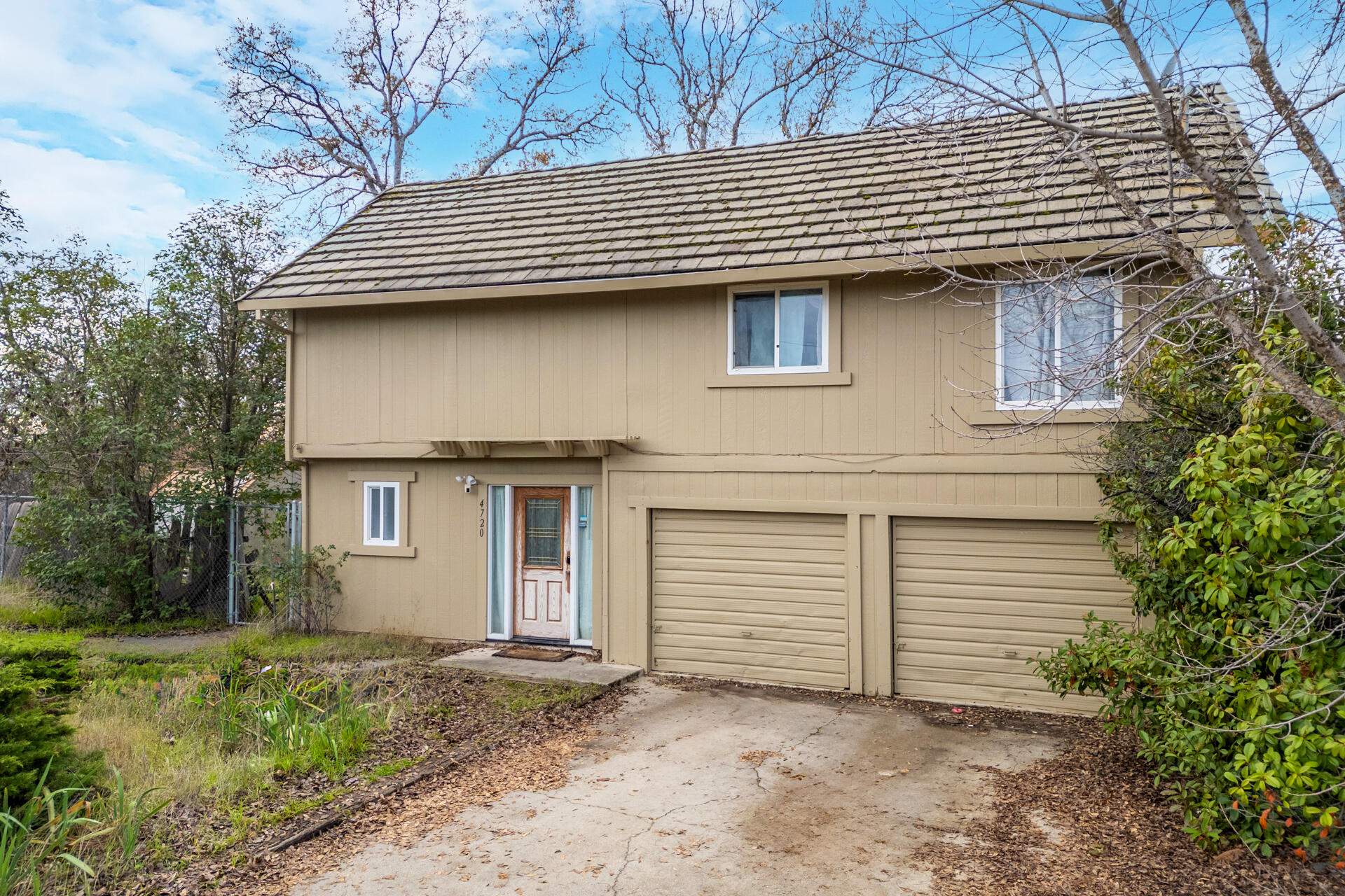 4720 Enchanted Way Redding, CA 96001 - Photo 18 of 19 a front view of a house with a yard